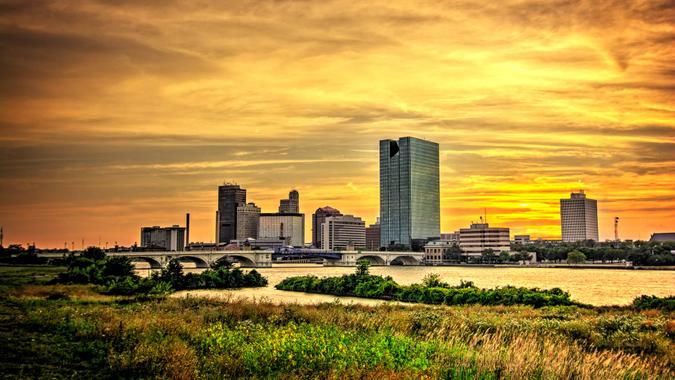 downtown Toledo Ohio's skyline at sunset from across the Maumee river.