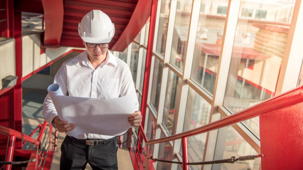 Engineer or Architect checking architectural drawing