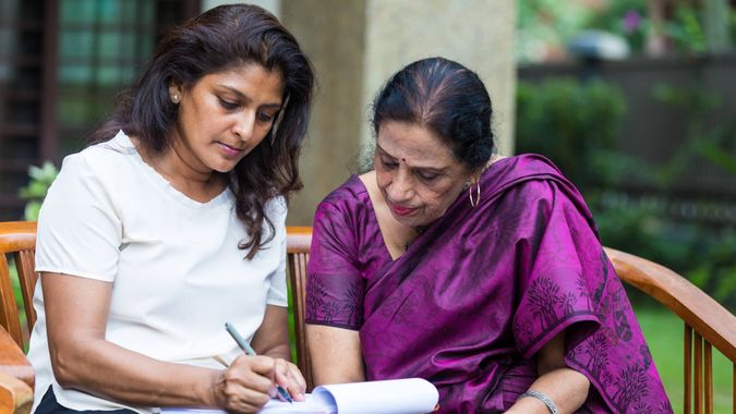 Women completing the last will and testament.