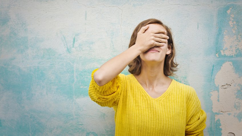 Young woman regretting a choice she has made.
