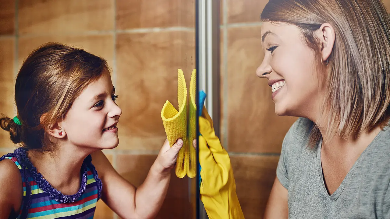 Cropped shot of a mother and her little daughter cleaning a bathroom together at home.