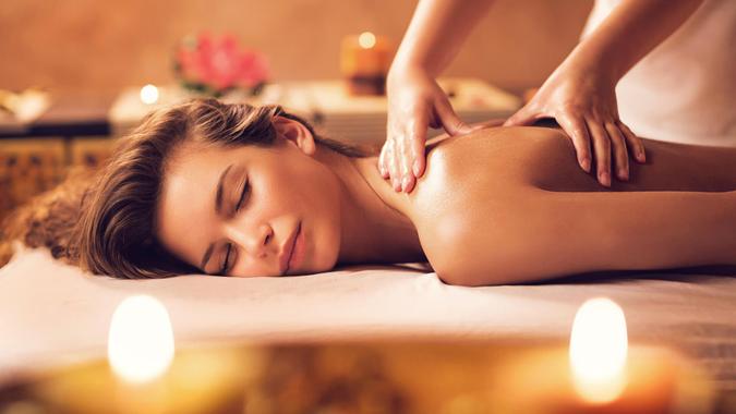 Beautiful woman receiving back massage at the spa.