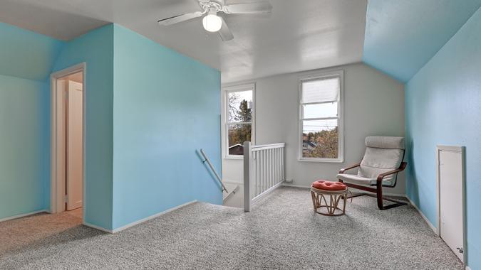 upstairs loft with carpeted flooring