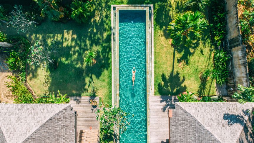 Woman floating on tropical waters.
