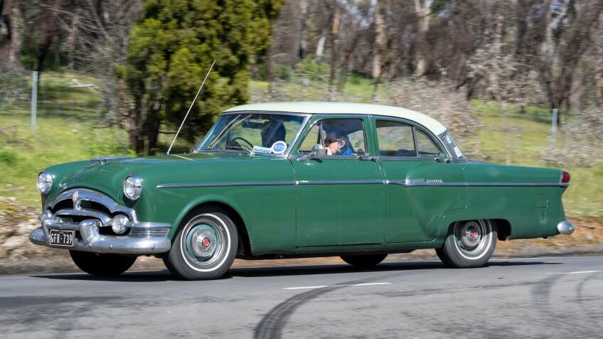 Adelaide, Australia - September 25, 2016: Vintage 1954 Packard Clipper Sedan driving on country roads near the town of Birdwood, South Australia.