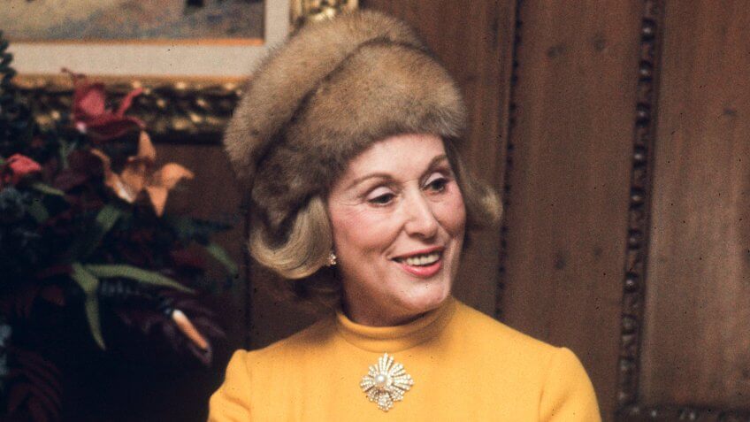 Photo by Tony Palmieri/Penske Media/REX/Shutterstock Estee Lauder wearing a yellow dress and fur hat, introducing a fragrance in her home Estee Lauder at Home, New York