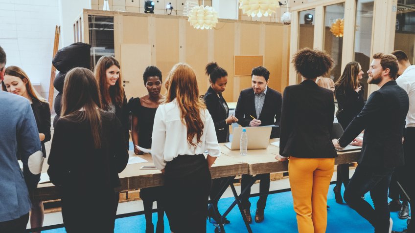 Group of business people in the office meeting.