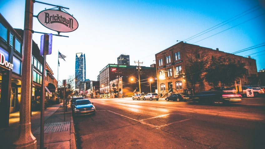 Oklahoma City, USA - February 19, 2014: Night in Bricktown entertainment district, many old warehouse buildings are now restaurants and bars.