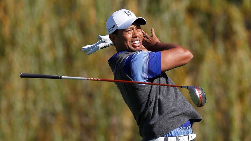 Tiger Woods drops club during Chevron World Challege