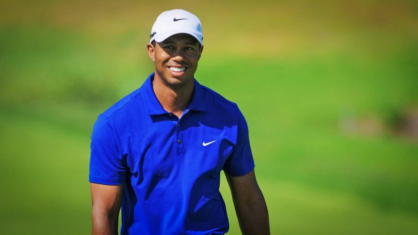 Tiger Woods smiles at Emirates Australian Golf Open in Sydney