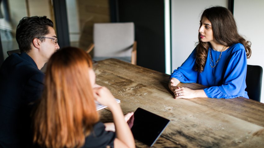 Three People Sitting At Office, HRs Questioning Young Woman.