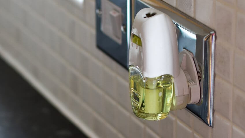 Air freshener plugged into socket in a clean tidy kitchen.