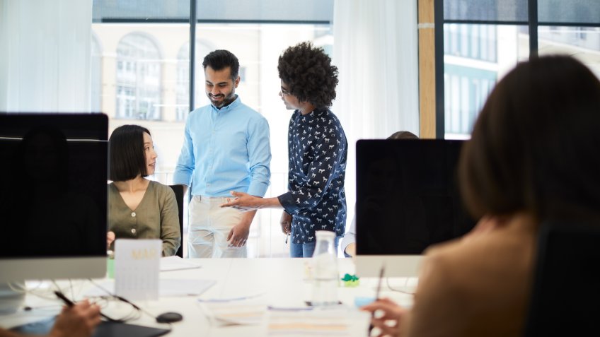 Business people working on an open office space.