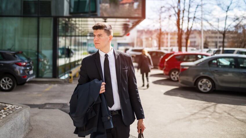businessman leaving his work for good after quitting