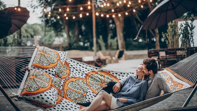 couple hanging out in their newly landscaped backyard