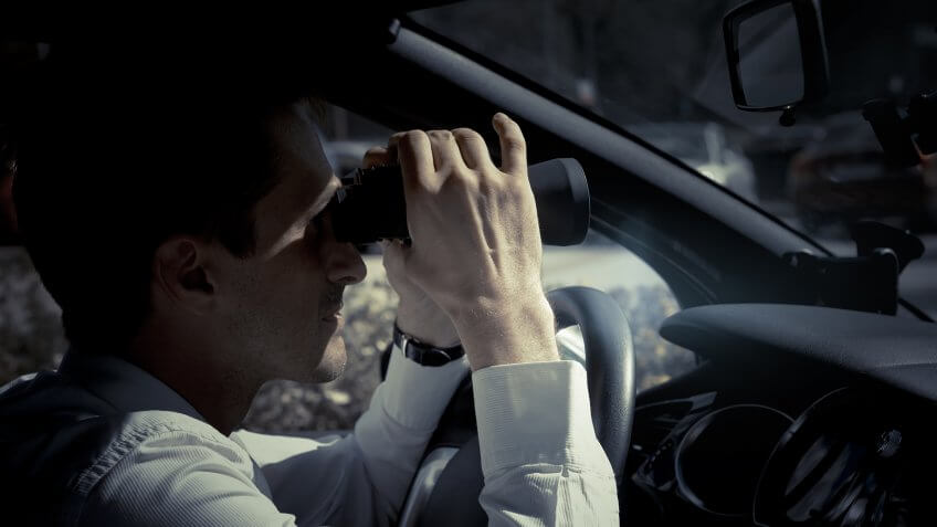 Man looking through binoculars.