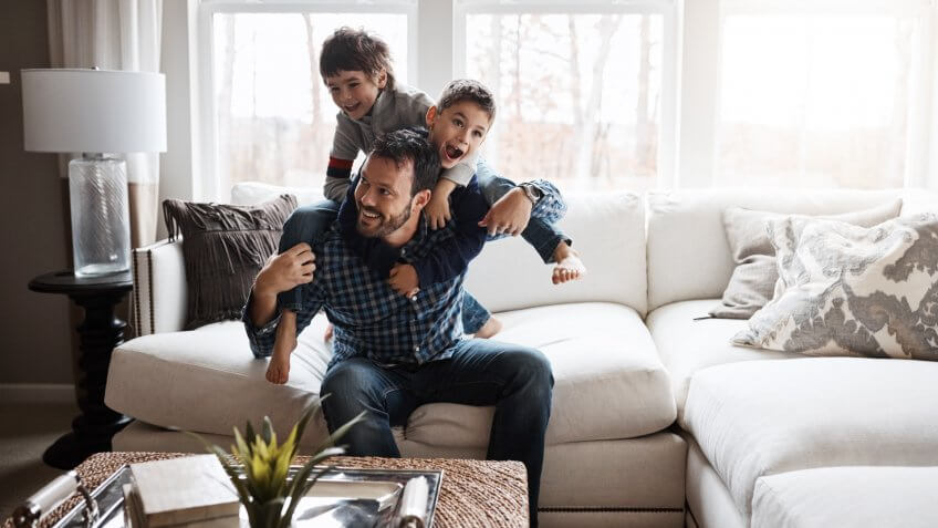 father with two sons at home
