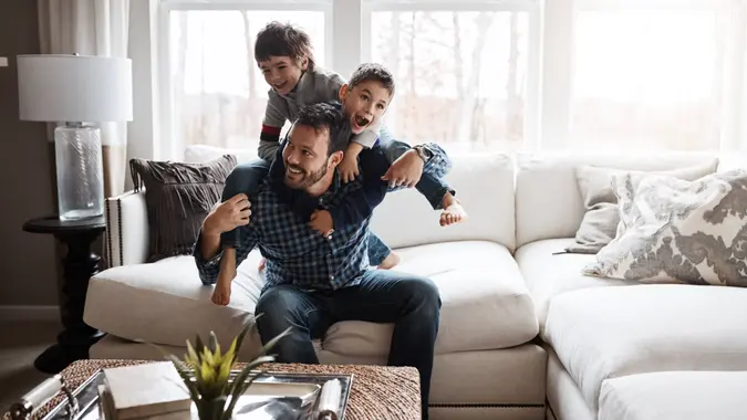 father with two sons at home