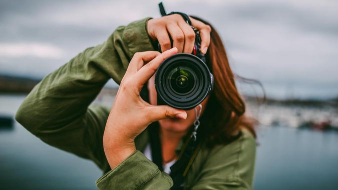 female photographer taking stock photographs