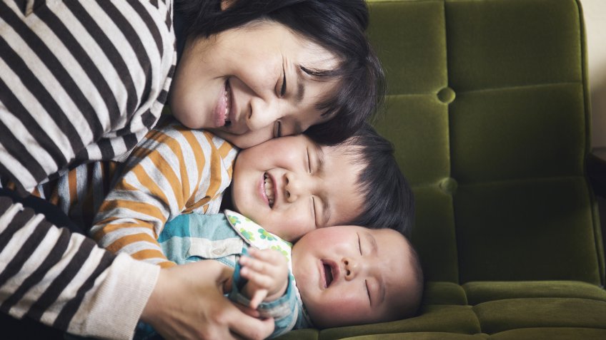 Japanese older brother hugging his younger sister.