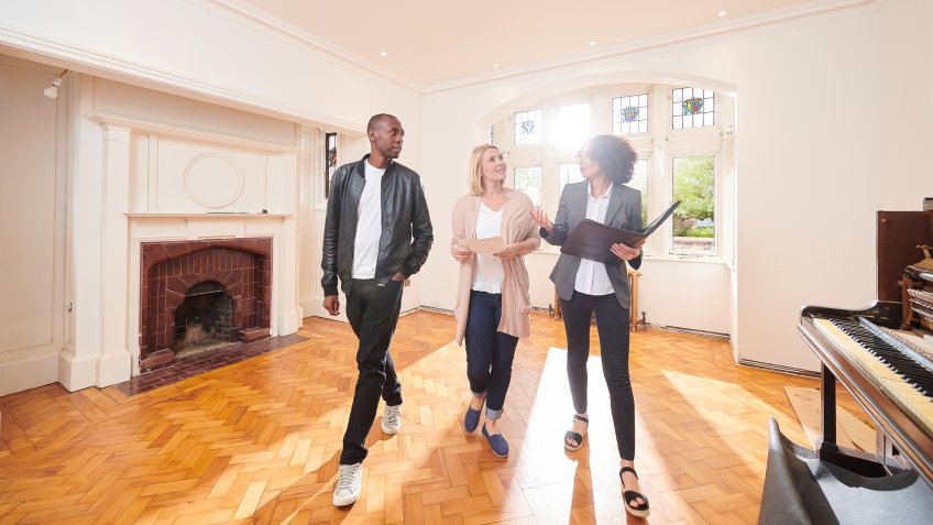 married couple looking at new house
