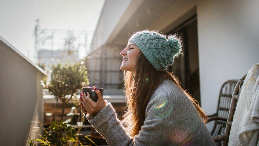 millennial woman drinking coffee thinking about retirement planning