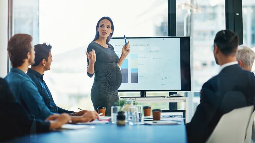 Cropped shot of a pregnant businesswoman giving a presentation in the boardroom.