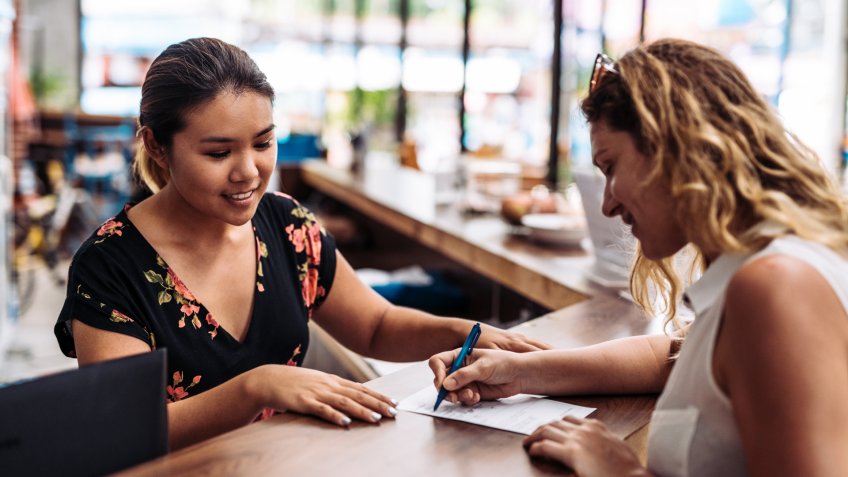 International guest is coming to the accommodation - hotel, hostel or guesthouse, and after successful check in, going with reception lady to the room.