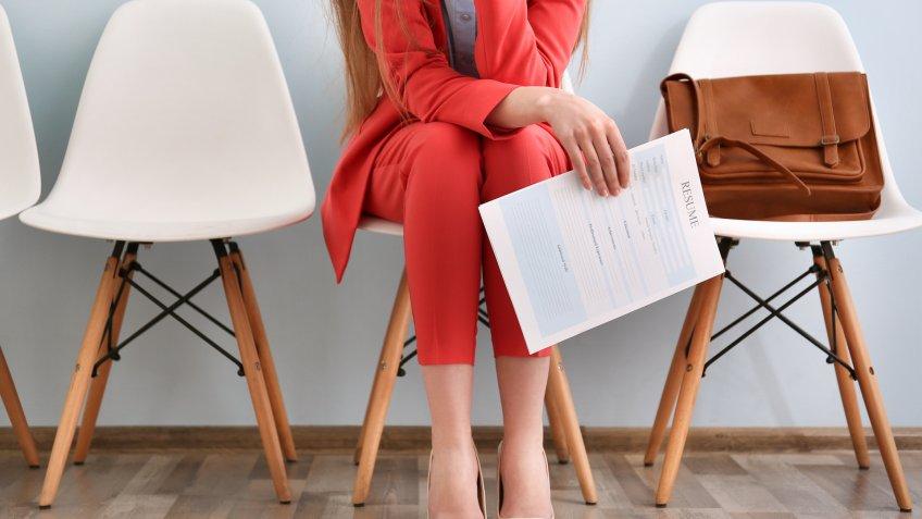 woman with her resume in waiting room