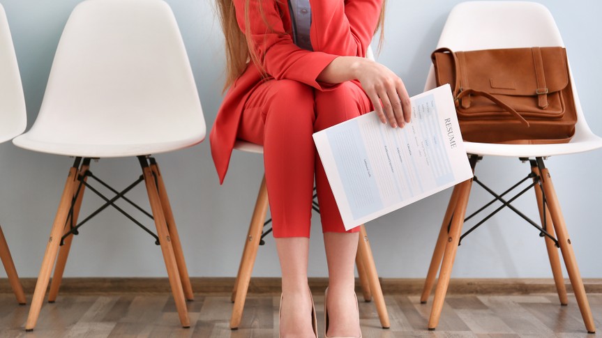 woman with her resume in waiting room