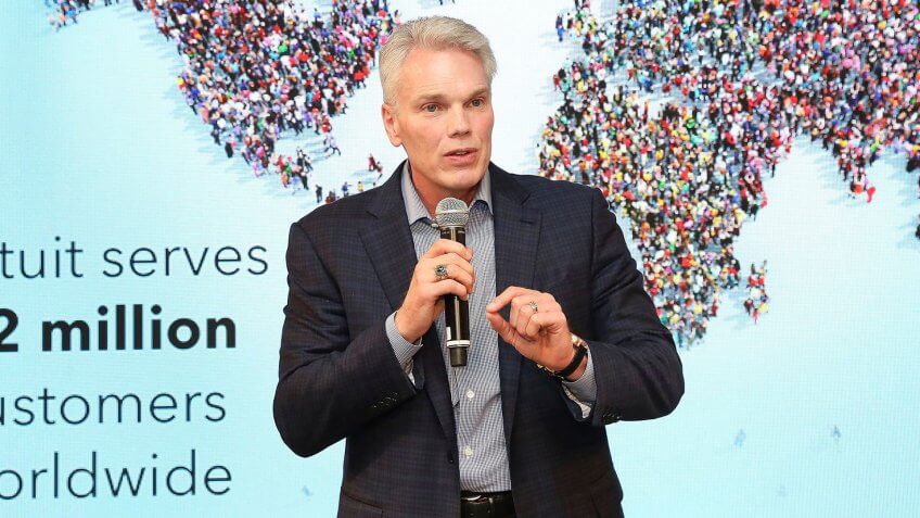 Brad Smith addresses attendees gathered at Intuit's gallery walk event in New York