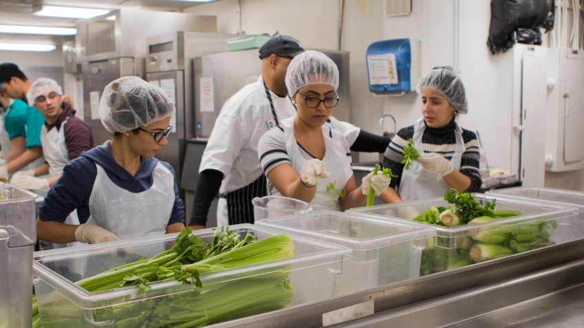 DC Central Kitchen workers sorting vegetables