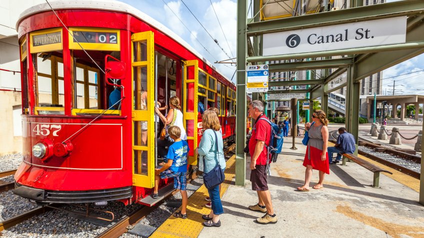 New Orleans, USA - July 16, 2013: people enter the riverfront Streetcar Line in New Orleans, USA.