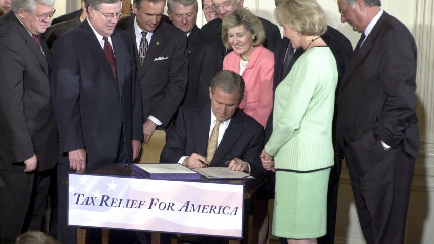 former American president George W. Bush signs $1.35 trillion tax cut bill
