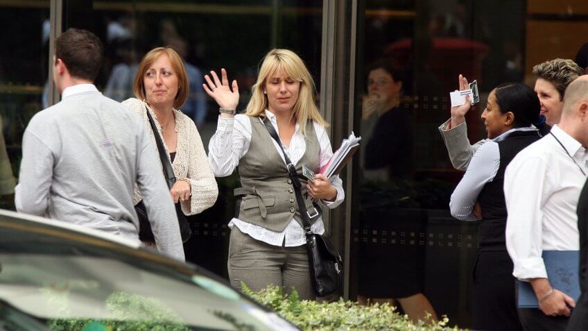 Lehman Brothers employees leaving the Canary Wharf building after the bank filed for bankruptcy