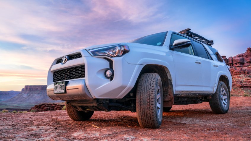 Moab , UT, USA - May 6, 2018: Toyota 4runner SUV (2016 trail edition, stock vehicle without any off road modifications)) on a desert trail before sunrise in the Moab area.