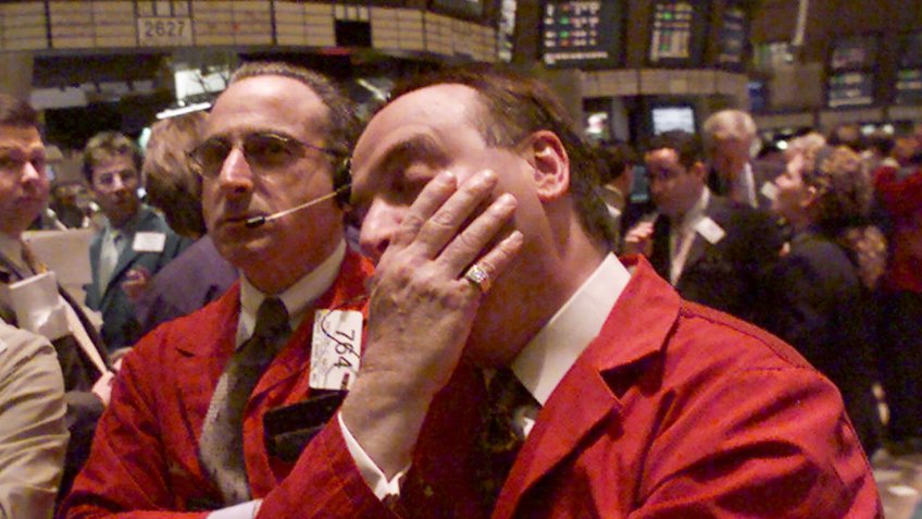 Traders looking at New York Stock Exchange boards in the year 2000