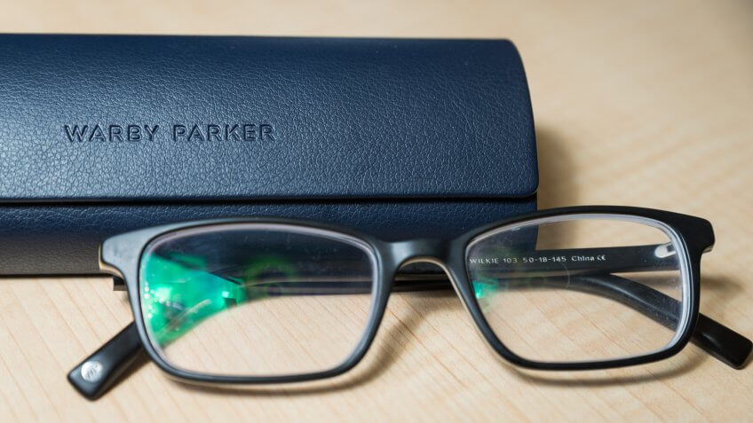 Hoboken NJ - February 5 2019: A pair of Warby Parker Wilkie glasses are shown with their case.
