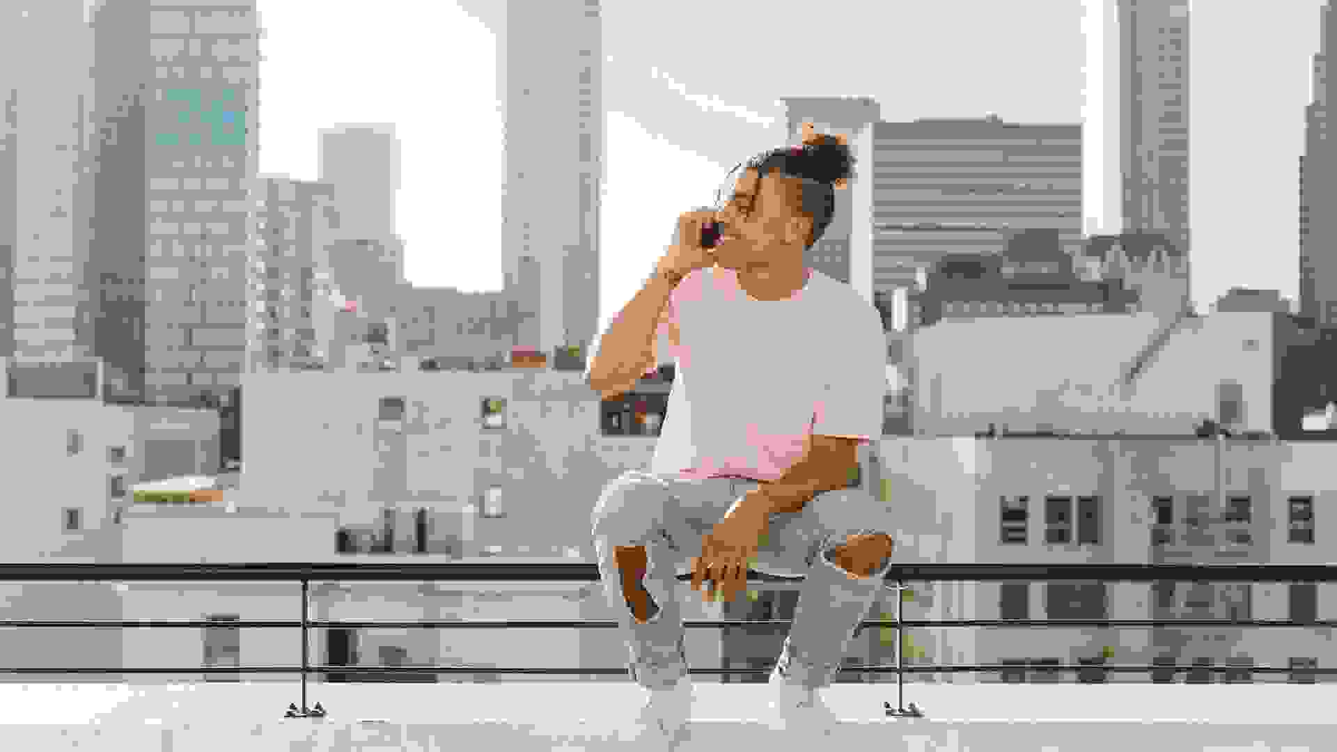 alone guy sitting on rooftop in Los Angeles