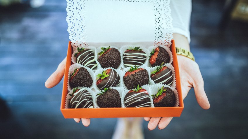 chocolate covered strawberries in a red box