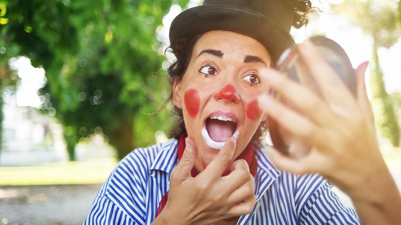 Professional female clown in makeup.