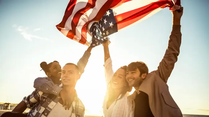 friends celebrating with American Flag for Memorial Day