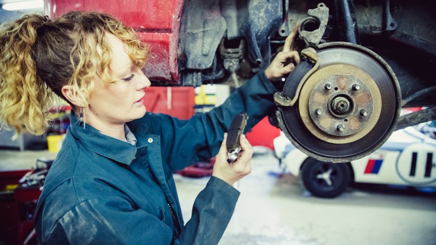 Brake Pad, Car, Repair, Mechanic, Safety, Rustic, Grease Monkey, Service - Female Mechanic Working at her Garage.
