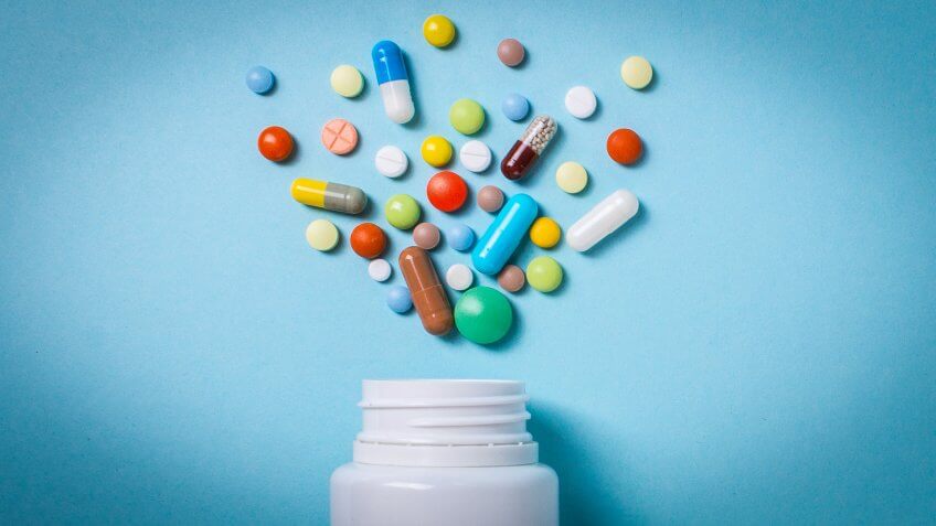 pharmaceutical medicine pill bottle with tablets and capsules