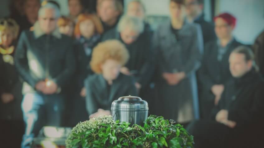 people mourning in the background