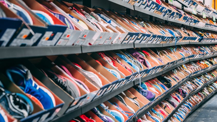 shoe store with rows of sneakers for sale