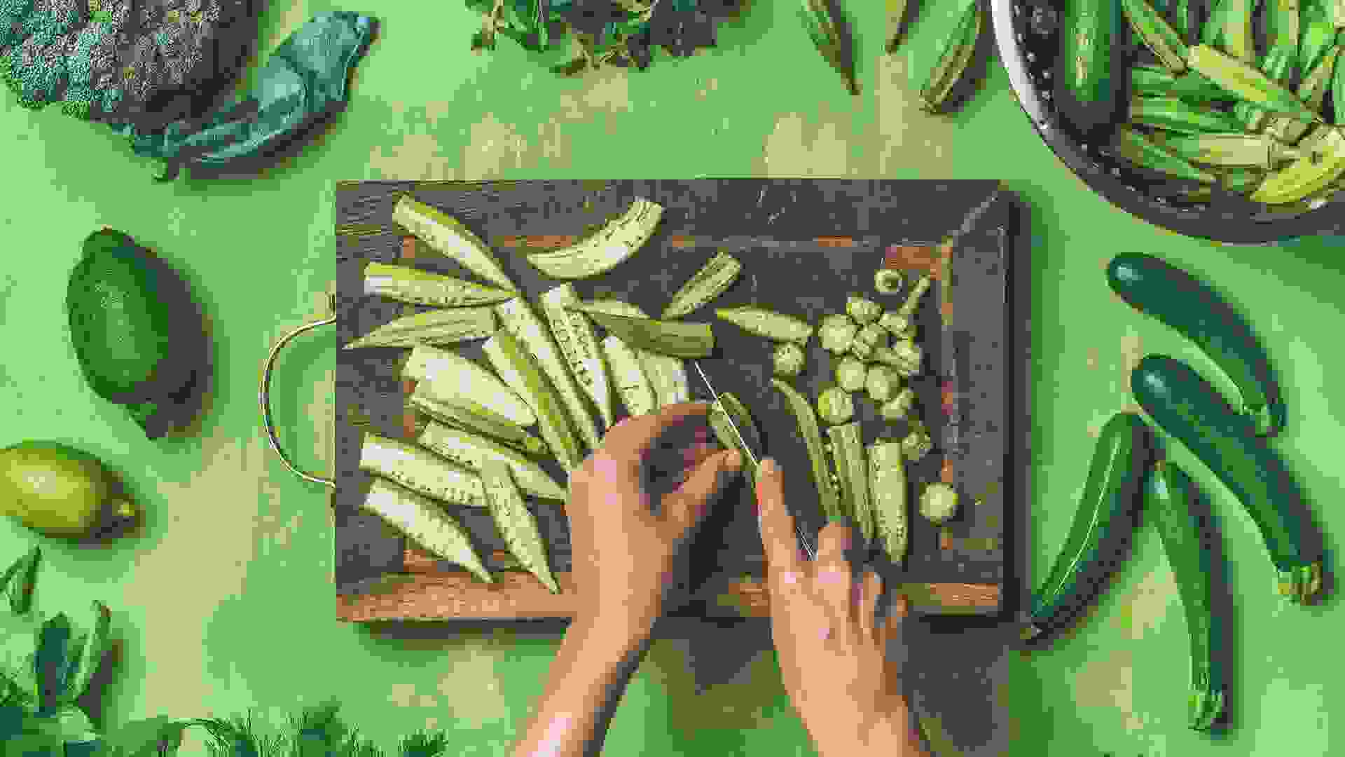 woman cutting healthy green vegetables