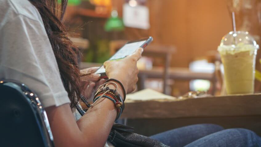 woman posting photos on social media