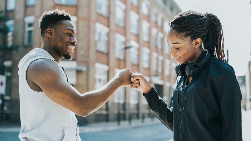 Fitness partners doing a fist bump.