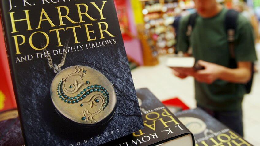 A Potter Fan Picks Up a Copy of J K Rowling's Final Harry Potter Book 'Harry Potter and the Deathly Hallows' at a Book Store in London